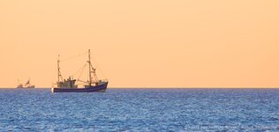 Lonely trawler boats at dusk.jpg